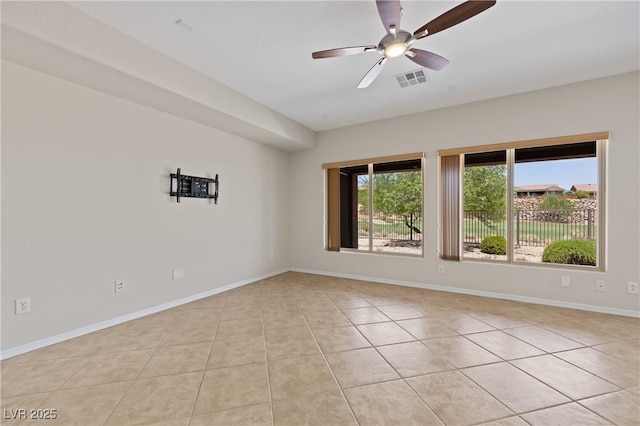1407 Wheelwright Ct, Mesquite, NV 89034 - unfurnished room featuring light tile patterned flooring, a ceiling fan, and baseboards