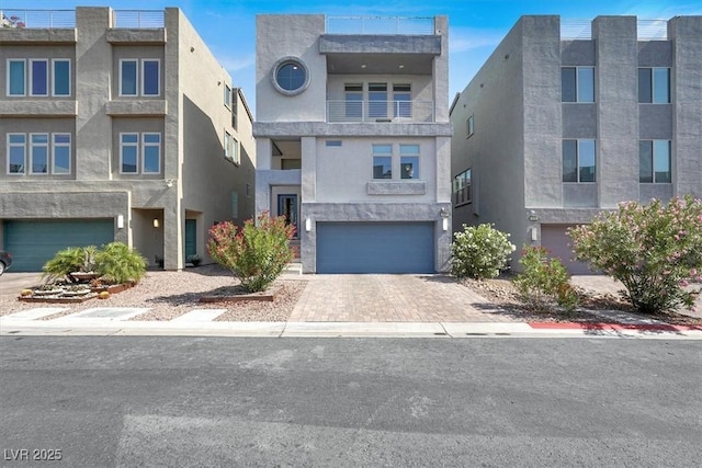8060 Haywood Estate Ave, Las Vegas, NV 89113 - view of front facade featuring an attached garage, decorative driveway, and stucco siding