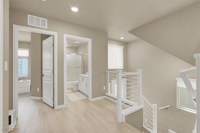 8060 Haywood Estate Ave, Las Vegas, NV 89113 - corridor with light wood finished floors, an upstairs landing, baseboards, and recessed lighting