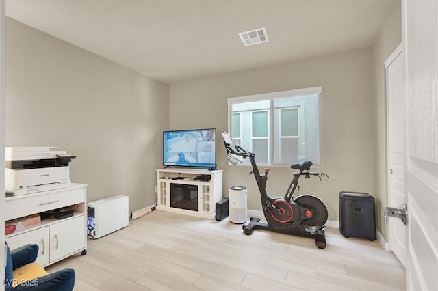 8060 Haywood Estate Ave, Las Vegas, NV 89113 - workout area featuring light wood-style flooring and baseboards