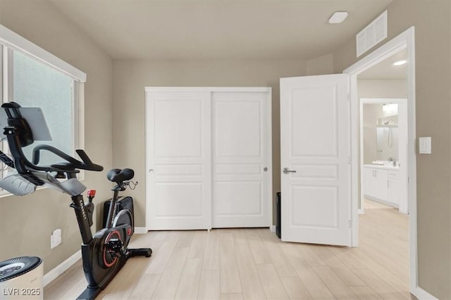 8060 Haywood Estate Ave, Las Vegas, NV 89113 - exercise room featuring light wood finished floors and baseboards