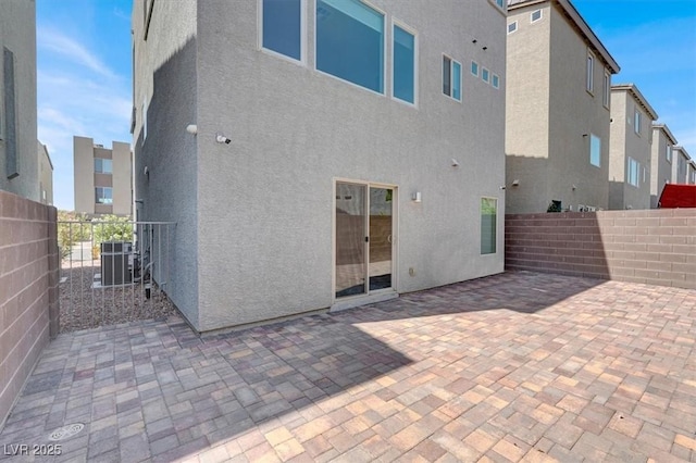 8060 Haywood Estate Ave, Las Vegas, NV 89113 - back of property with stucco siding, a patio, and central air condition unit