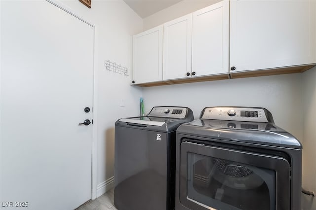 632 Monument Point St, Henderson, NV 89002 - laundry area featuring cabinet space, separate washer and dryer, baseboards, and light wood finished floors