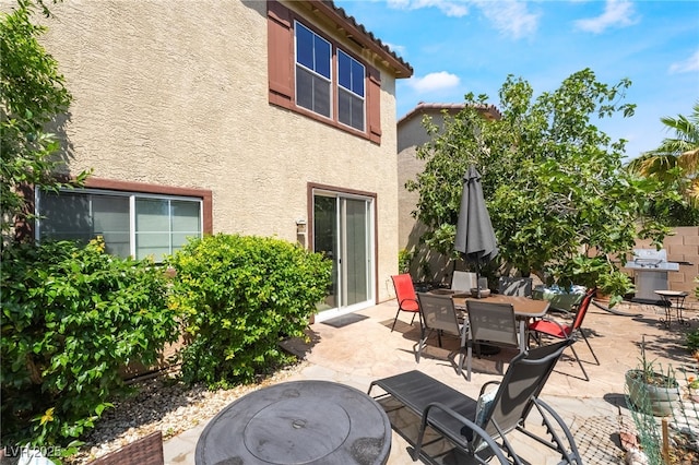 632 Monument Point St, Henderson, NV 89002 - view of patio with grilling area and outdoor dining space