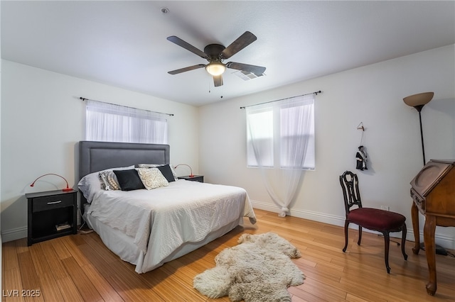 632 Monument Point St, Henderson, NV 89002 - bedroom with baseboards, light wood-style floors, and a ceiling fan