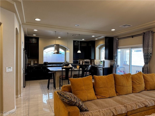 6454 Mount Palomar Ave, Las Vegas, NV 89139 - living room featuring arched walkways, recessed lighting, and a tray ceiling