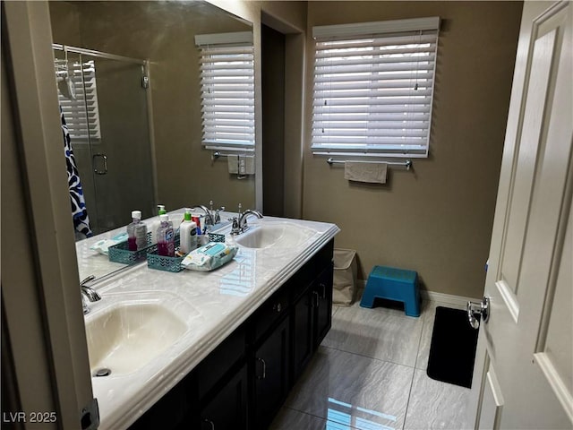 6454 Mount Palomar Ave, Las Vegas, NV 89139 - full bath featuring a shower stall, double vanity, baseboards, and tile patterned floors