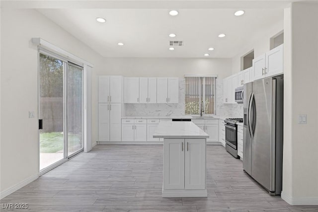 2367 Tilden Way, Henderson, NV 89074 - kitchen featuring stainless steel appliances, a sink, healthy amount of natural light, white cabinets, and recessed lighting