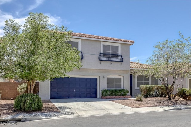 2367 Tilden Way, Henderson, NV 89074 - mediterranean / spanish home featuring a tiled roof, an attached garage, concrete driveway, and stucco siding