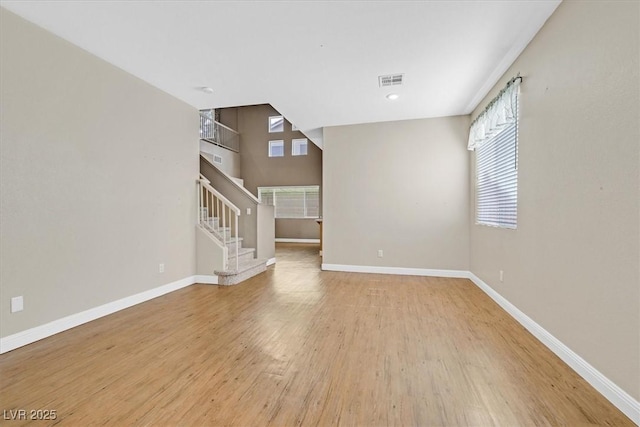 927 Clear Diamond Ave, Las Vegas, NV 89123 - unfurnished living room with healthy amount of natural light, light wood-type flooring, baseboards, and recessed lighting