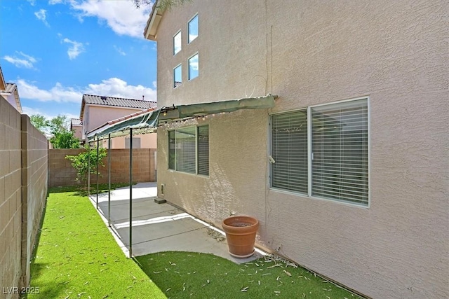 927 Clear Diamond Ave, Las Vegas, NV 89123 - fenced backyard with a patio