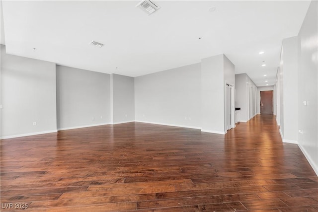 4575 Dean Martin Dr Unit 304, Las Vegas, NV 89103 - empty room with dark wood-style flooring, baseboards, and recessed lighting