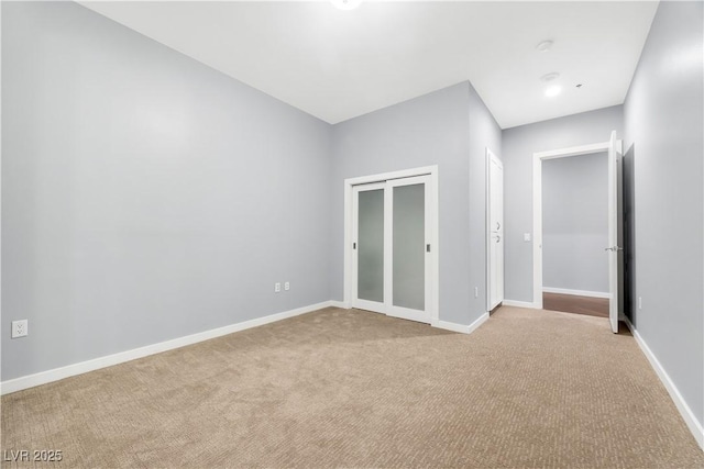 4575 Dean Martin Dr Unit 304, Las Vegas, NV 89103 - unfurnished bedroom featuring light colored carpet, baseboards, and a closet