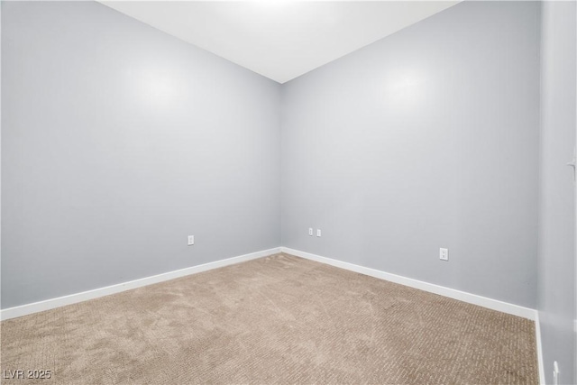4575 Dean Martin Dr Unit 304, Las Vegas, NV 89103 - carpeted empty room featuring baseboards and lofted ceiling