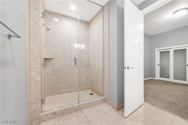 4575 Dean Martin Dr Unit 304, Las Vegas, NV 89103 - bathroom featuring a stall shower, tile patterned flooring, and baseboards