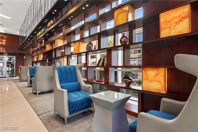 4575 Dean Martin Dr Unit 304, Las Vegas, NV 89103 - building lobby featuring a high ceiling and wood walls
