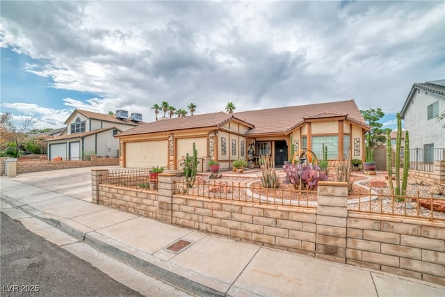 6508 Peppermill Dr, Las Vegas, NV 89146 - view of front of house featuring concrete driveway, a garage, stucco siding, and a tiled roof