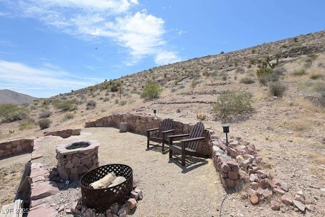 275 Vegas Dr, Goodsprings, NV 89019 - view of patio featuring an outdoor fire pit and a mountain view