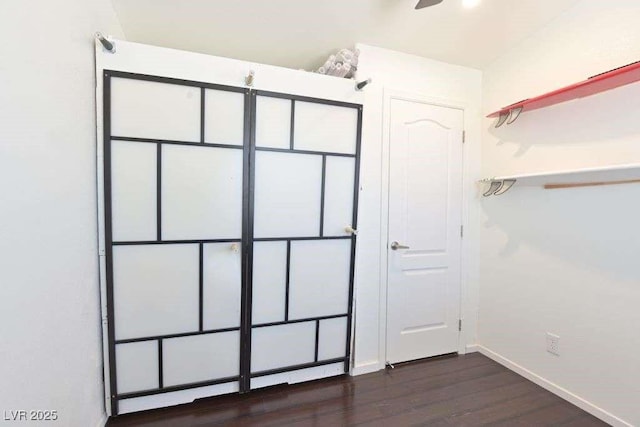 275 Vegas Dr, Goodsprings, NV 89019 - unfurnished bedroom with dark wood finished floors and baseboards