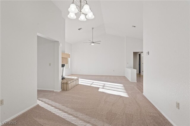 9105 Marble Dr, Las Vegas, NV 89134 - unfurnished living room with high vaulted ceiling, carpet, a chandelier, a ceiling fan, and baseboards