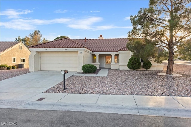 9105 Marble Dr, Las Vegas, NV 89134 - mediterranean / spanish-style house with a tiled roof, a chimney, an attached garage, driveway, and stucco siding