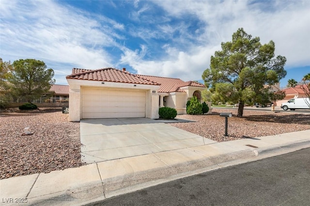 9105 Marble Dr, Las Vegas, NV 89134 - mediterranean / spanish home featuring a tile roof, driveway, stucco siding, and an attached garage