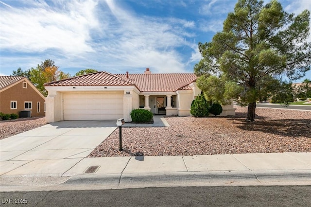 9105 Marble Dr, Las Vegas, NV 89134 - mediterranean / spanish house with a tiled roof, an attached garage, a chimney, stucco siding, and concrete driveway