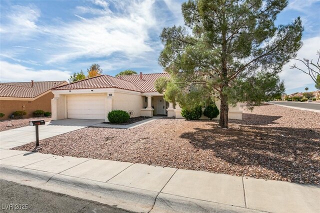 9105 Marble Dr, Las Vegas, NV 89134 - mediterranean / spanish-style house with a tiled roof, stucco siding, concrete driveway, and a garage
