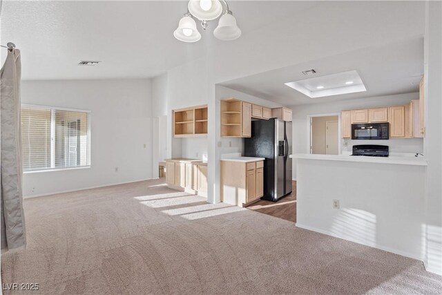 9105 Marble Dr, Las Vegas, NV 89134 - kitchen with black microwave, stainless steel refrigerator with ice dispenser, stove, open shelves, and carpet flooring