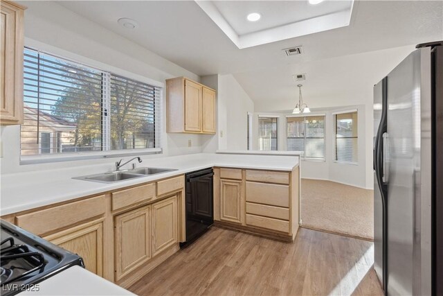 9105 Marble Dr, Las Vegas, NV 89134 - kitchen featuring freestanding refrigerator, light brown cabinets, dishwasher, a sink, and a peninsula