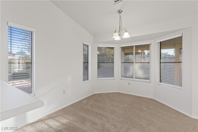9105 Marble Dr, Las Vegas, NV 89134 - empty room featuring carpet floors, a chandelier, lofted ceiling, and baseboards