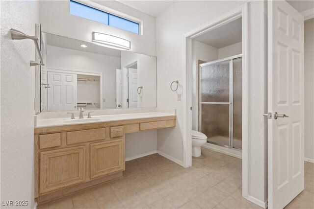 9105 Marble Dr, Las Vegas, NV 89134 - full bath with a stall shower, toilet, vanity, and baseboards