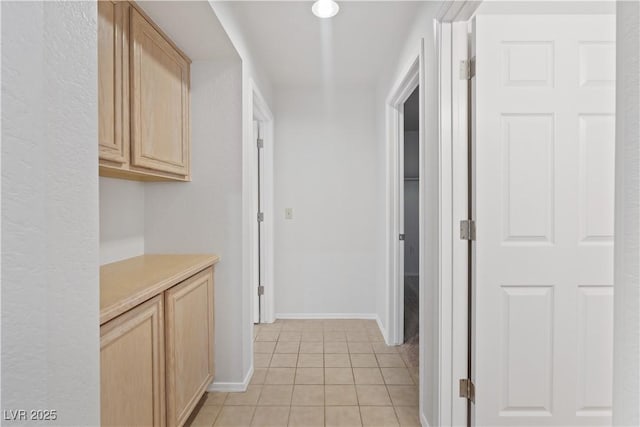 9105 Marble Dr, Las Vegas, NV 89134 - corridor with light tile patterned floors and baseboards