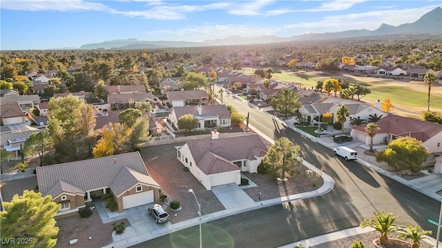 9105 Marble Dr, Las Vegas, NV 89134 - aerial perspective of suburban area with a mountainous background and a golf course