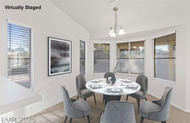 9105 Marble Dr, Las Vegas, NV 89134 - dining space featuring a chandelier, carpet floors, vaulted ceiling, and baseboards