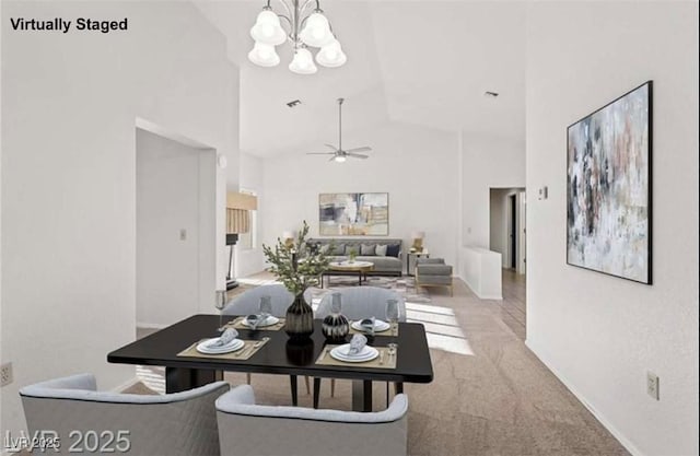 9105 Marble Dr, Las Vegas, NV 89134 - carpeted dining area featuring high vaulted ceiling, a chandelier, ceiling fan, and baseboards