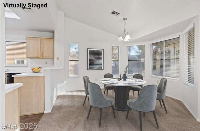 9105 Marble Dr, Las Vegas, NV 89134 - dining space featuring a chandelier, carpet, lofted ceiling, and baseboards