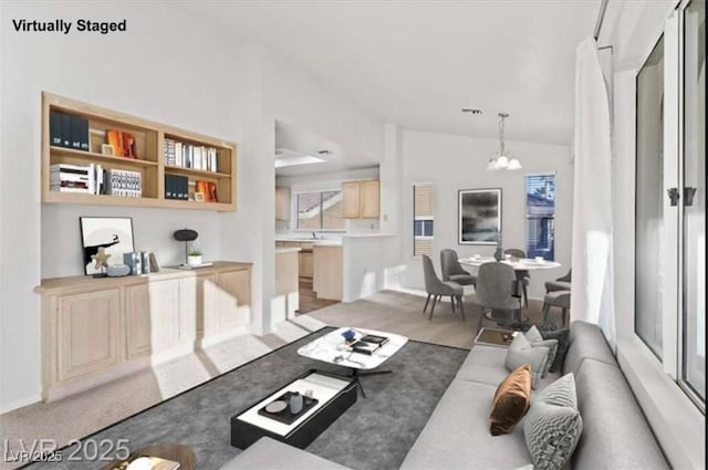 9105 Marble Dr, Las Vegas, NV 89134 - living area with a chandelier and lofted ceiling
