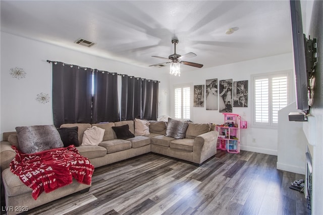 4429 E Azure Ave, Las Vegas, NV 89115 - living area featuring dark wood-style floors, a ceiling fan, and baseboards