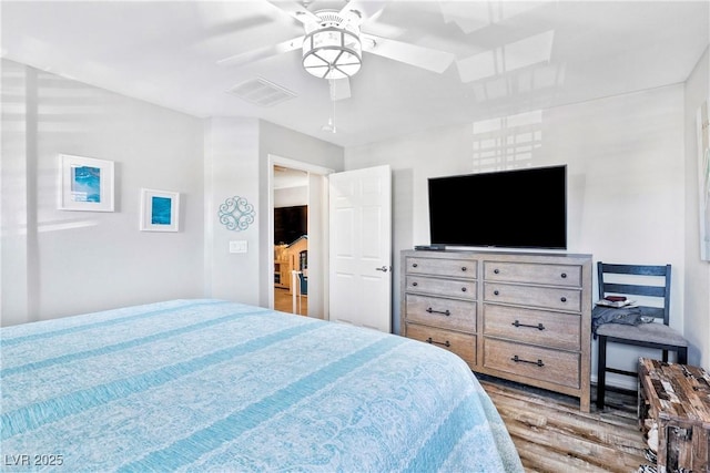 2225 Chandler Ranch Pl, Laughlin, NV 89029 - bedroom with wood finished floors and a ceiling fan