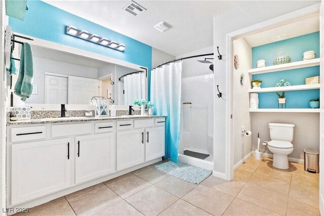 2225 Chandler Ranch Pl, Laughlin, NV 89029 - full bath featuring double vanity, a shower stall, toilet, and tile patterned flooring