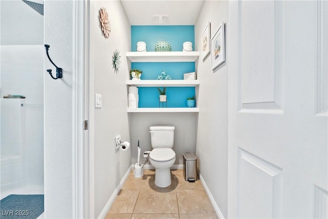 2225 Chandler Ranch Pl, Laughlin, NV 89029 - full bathroom featuring a tile shower, toilet, baseboards, and tile patterned flooring