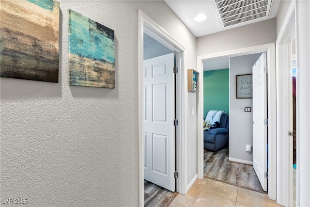 2225 Chandler Ranch Pl, Laughlin, NV 89029 - hallway with baseboards and light tile patterned floors