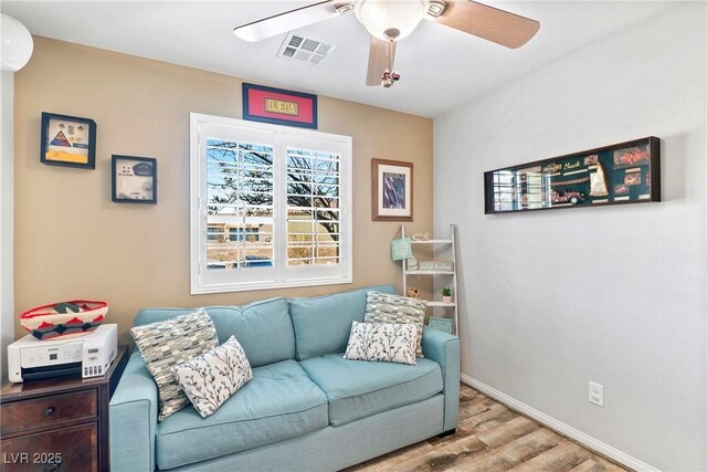 2225 Chandler Ranch Pl, Laughlin, NV 89029 - living room with wood finished floors, ceiling fan, and baseboards