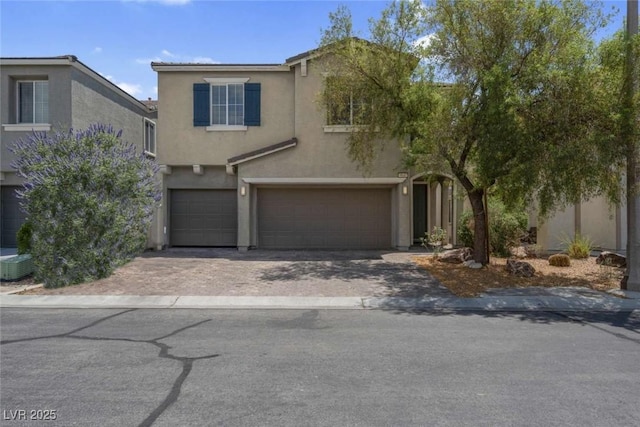 9840 Chief Sky St, Las Vegas, NV 89178 - traditional-style home featuring an attached garage, stucco siding, driveway, and central air condition unit