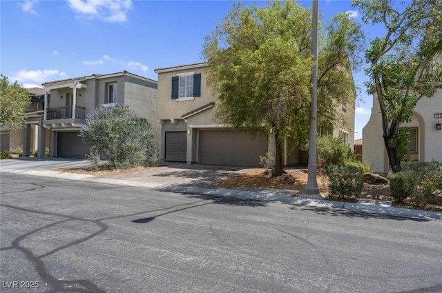 9840 Chief Sky St, Las Vegas, NV 89178 - view of front of home with a garage, stucco siding, and driveway