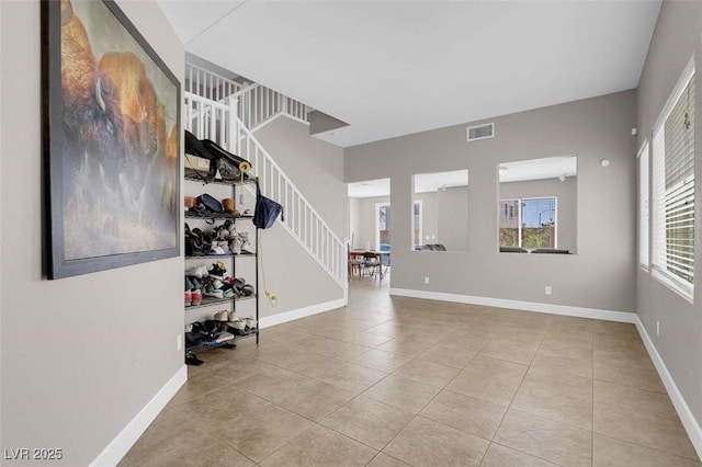 9840 Chief Sky St, Las Vegas, NV 89178 - tiled entrance foyer featuring stairway and baseboards