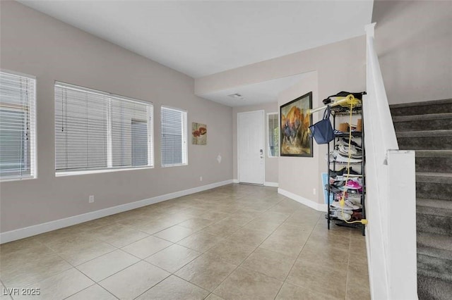 9840 Chief Sky St, Las Vegas, NV 89178 - spare room with stairs, tile patterned floors, and baseboards