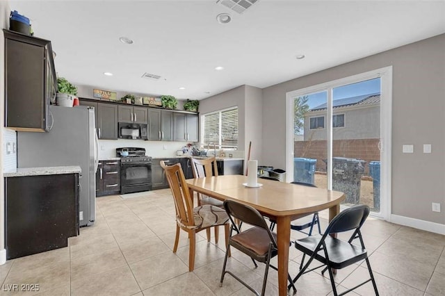 9840 Chief Sky St, Las Vegas, NV 89178 - dining area featuring light tile patterned floors, recessed lighting, and baseboards
