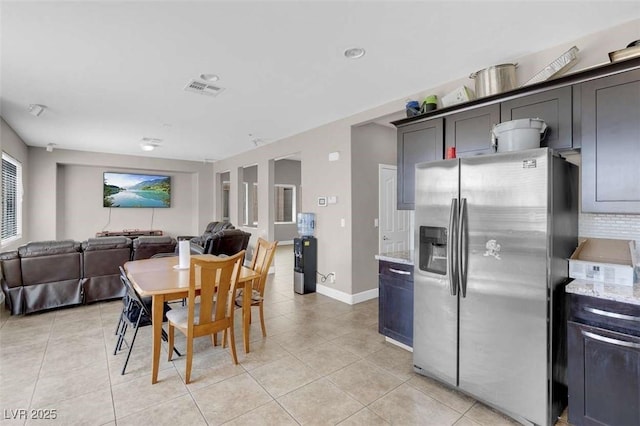 9840 Chief Sky St, Las Vegas, NV 89178 - dining area with light tile patterned floors and baseboards